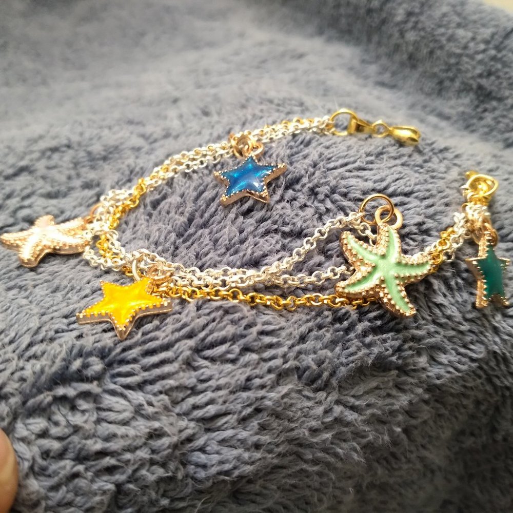 Colorful sea stars gold and silver dual tone chain linked charm bracelet